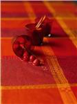Mille Wax laminated french table linens in Ketchup